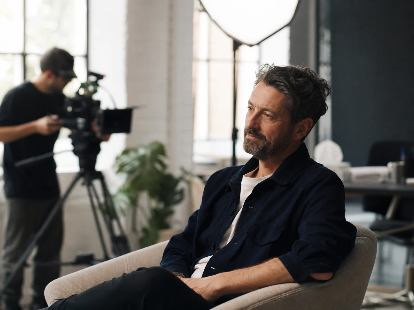 A relaxed interview subject preparing for a film shoot.