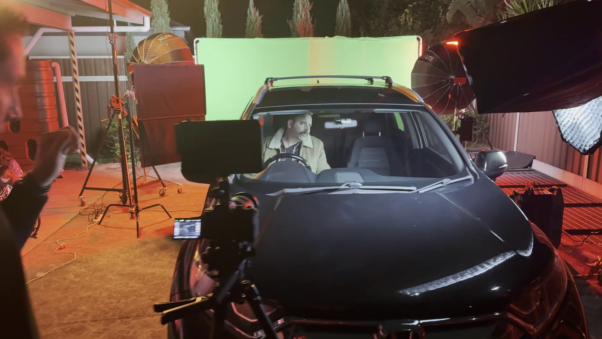 Car on green screen stage with camera rig